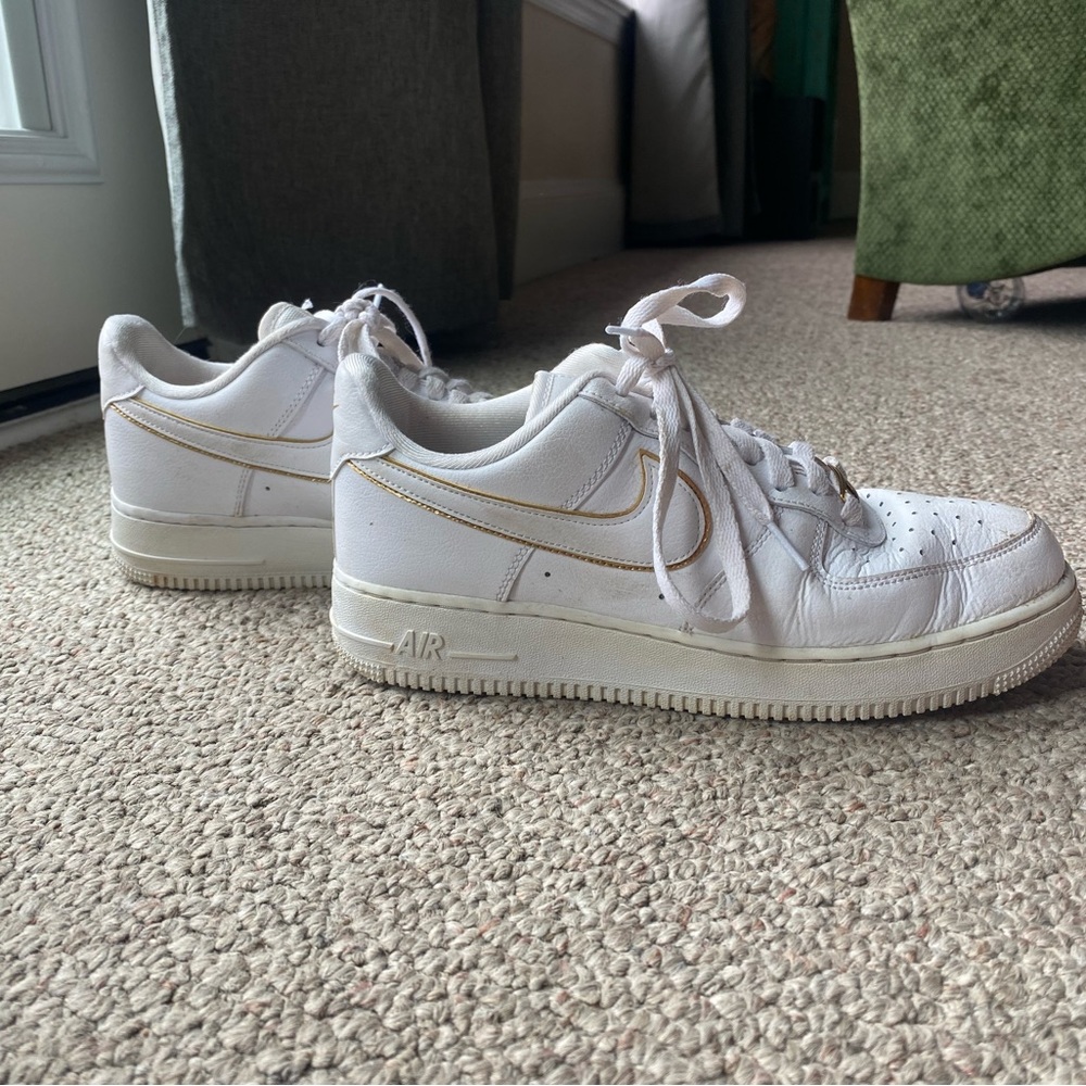 White Air Force ones with gold detail